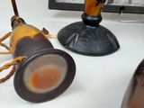 two vases that are sitting on a table