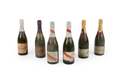 a group of six bottles of champagne sitting next to each other