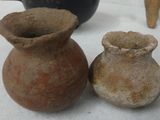 two vases sitting next to each other on a table