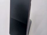 a cell phone that is sitting on top of a stand