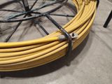 a yellow hose that is connected to a bicycle wheel