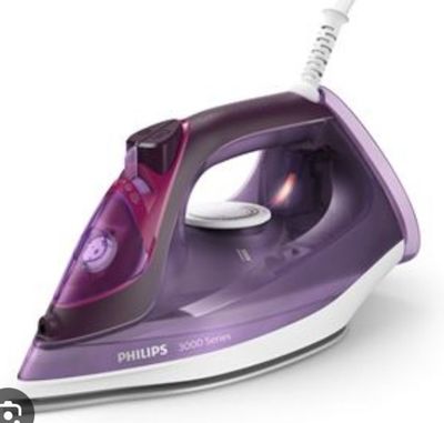 a purple and white iron sitting on top of a white surface