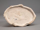 a white plate with a flower decoration on it