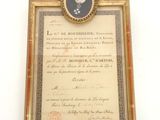 un vieux document sur lequel figure la photo d'un homme