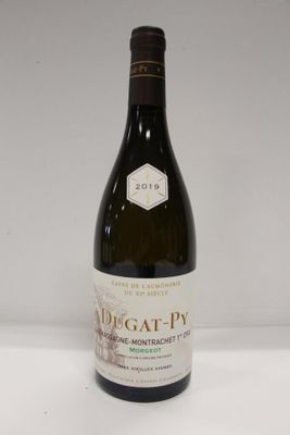 an image of a bottle of wine sitting on top of a table
