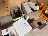 many boxes of wine sitting on the floor next to each other