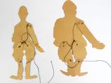 two pieces of paper cut out of a man and a woman