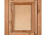a close up of a picture of a wooden frame on a wall