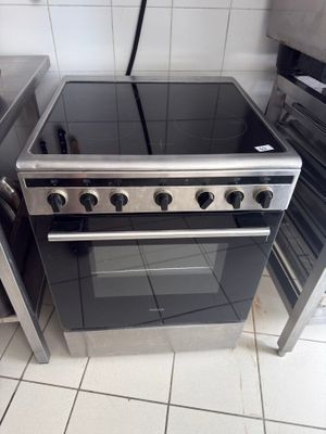 a stove and oven in a kitchen with tile flooring