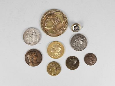 five different types of coins on a white surface