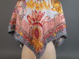 a close up of a woman ' s shawl on a mannequin head