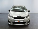 the front view of a silver car in a white room