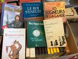 a lot of books that are sitting on a table