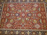 an oriental rug with a red and blue design on it