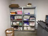 a room that has a bunch of boxes on the shelves