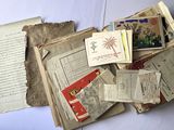 a pile of old books on a white table