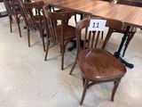 tables and chairs are lined up in a store with a price tag on them