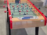 a foosball table in the middle of a garage