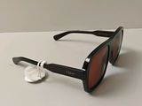 a close up of a pair of sunglasses on a table