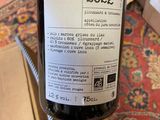 a bottle of wine that is sitting on a table