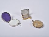 a small silver box with a purple lid and a small silver box with a purple lid and a small silver box with a purple lid