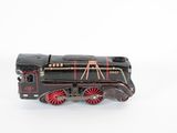 a black and red toy train on a white surface