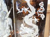 two vases that have been decorated with a dragon on them