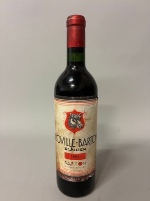 an old bottle of wine sitting on top of a table
