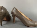 an image of a pair of women ' s shoes on a gray surface