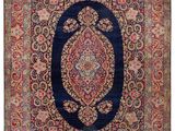 un tapis persan ancien, avec une bordure bleue et un motif en médaillon