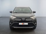 the front of a grey toyota rav parked in a room