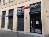 a store front with a sign on the side of it