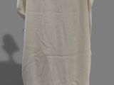 an image of a mannequin wearing a beige dress and black shoes