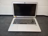 a laptop that is sitting on the floor