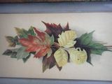 a picture of a painting of leaves on the wall