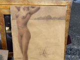 an old picture of a nude woman standing in the sand