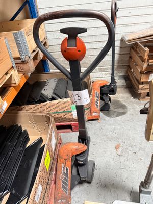 an image of a fork with a handle in a warehouse