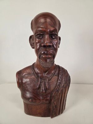 an image of a busturine of a man with a beard