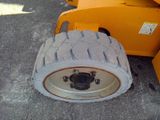 a tire that is sitting on the ground next to a machine