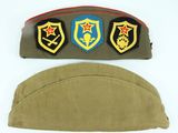 an image of a military hat with three patches on it