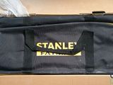 the large black bag is sitting on top of a cardboard box
