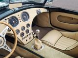 a dashboard and steering wheel of a sports car