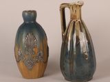 two vases sitting next to each other on a table