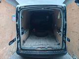 the back of a van with the door open and the back of the van in the back
