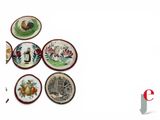 many plates with different designs on them on a white surface