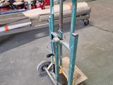 a hand truck that is sitting in a warehouse