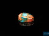 an image of a colorful stone in the dark