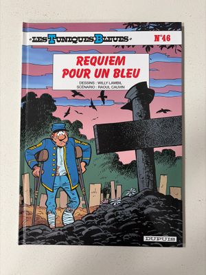 la couverture d'une bande dessinée représentant un homme debout devant une croix