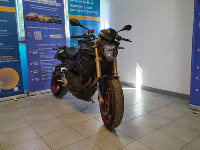 a motorcycle that is parked in a showroom