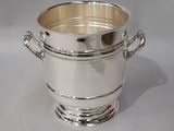 silver plated ice bucket with handles and handles on a white background